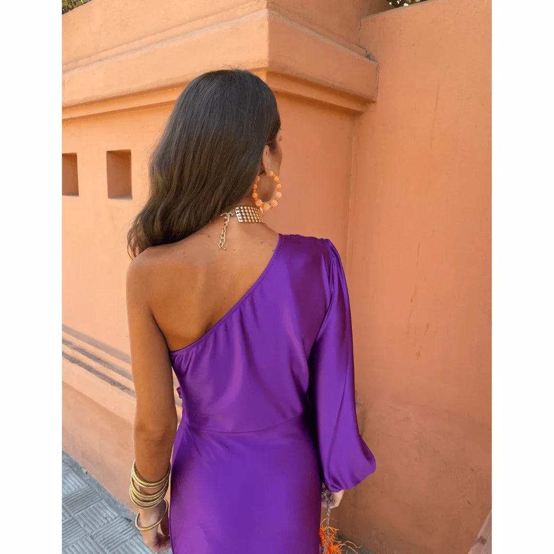 Beautiful women's one-shoulder evening maxi dress. Elegant formal wear with a captivating front slit design.