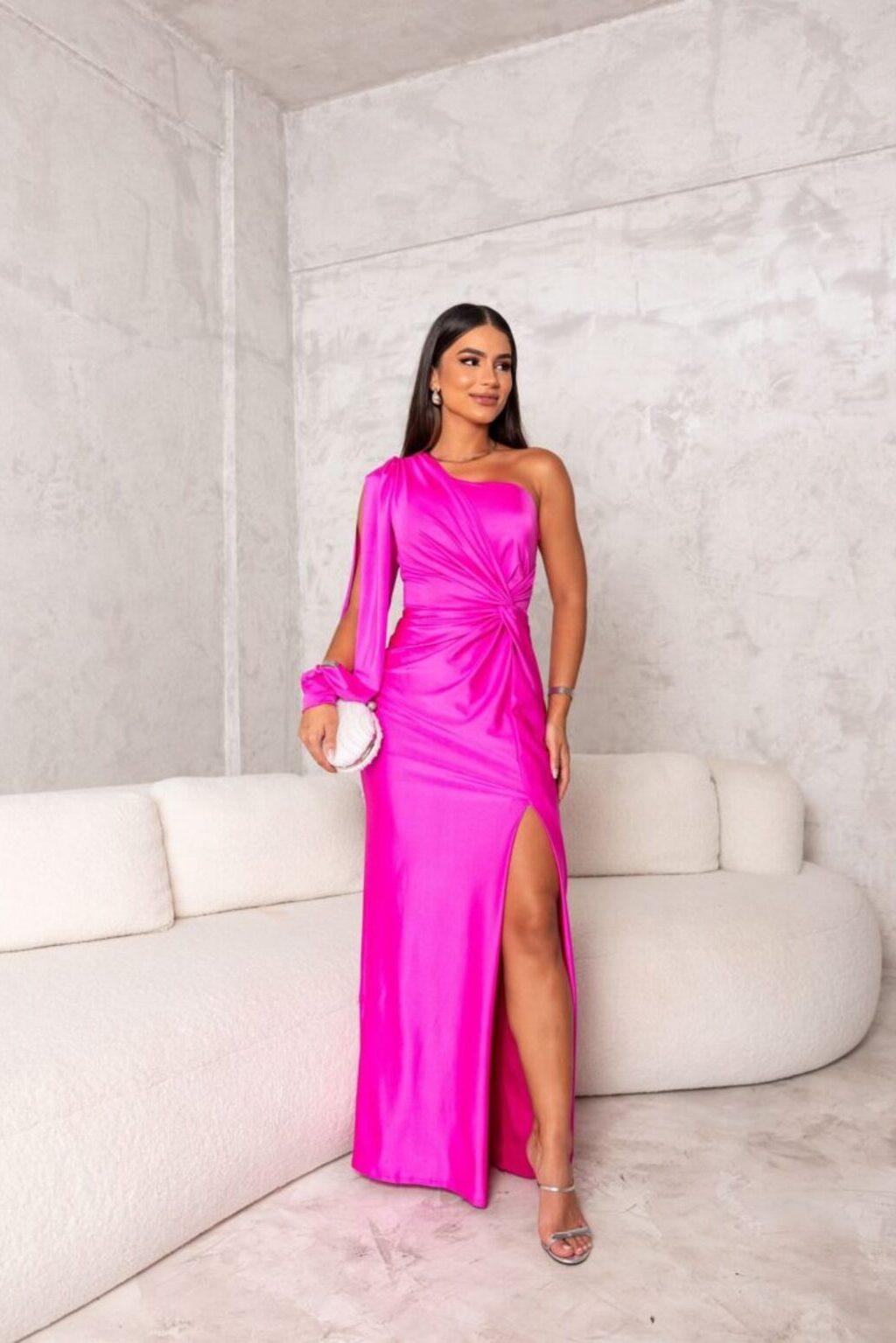 Modern one-shoulder formal dress for women, flowing maxi design with a graceful slit.