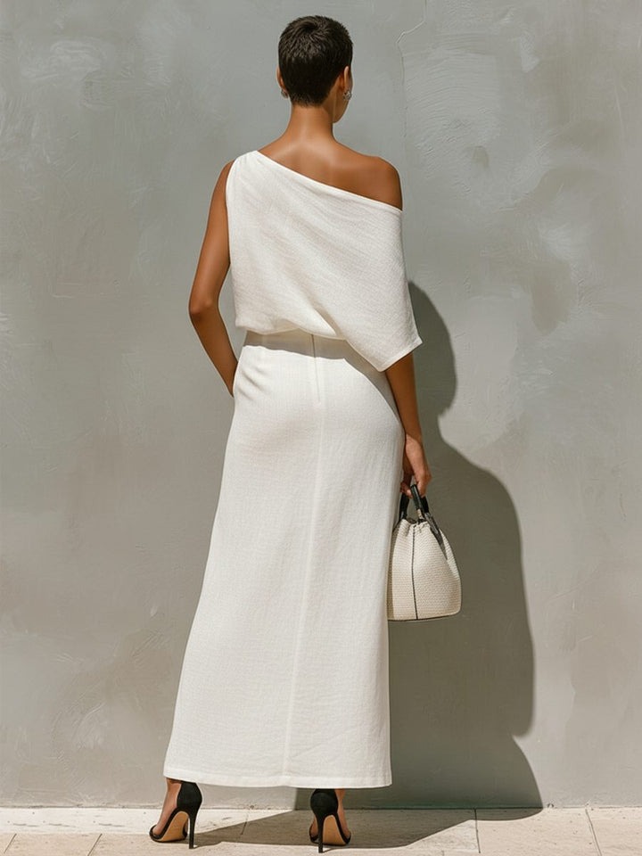 Stylish women's one-shoulder top & flowing maxi skirt with front split. Elegant, chic summer set for modern fashion.