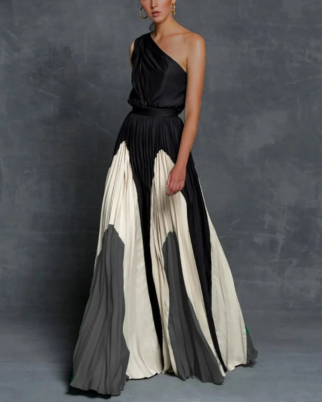 Beautiful women's elegant pleated one-shoulder maxi dress, a stunning formal gown for special occasions.