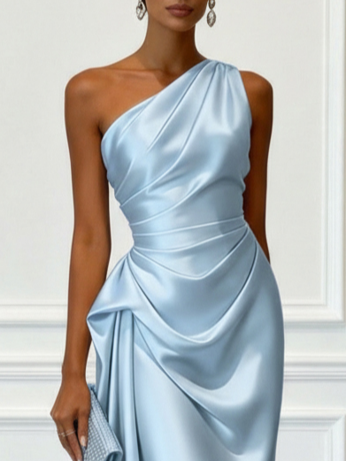 Chic ruched detailing on this one-shoulder midi cocktail dress.