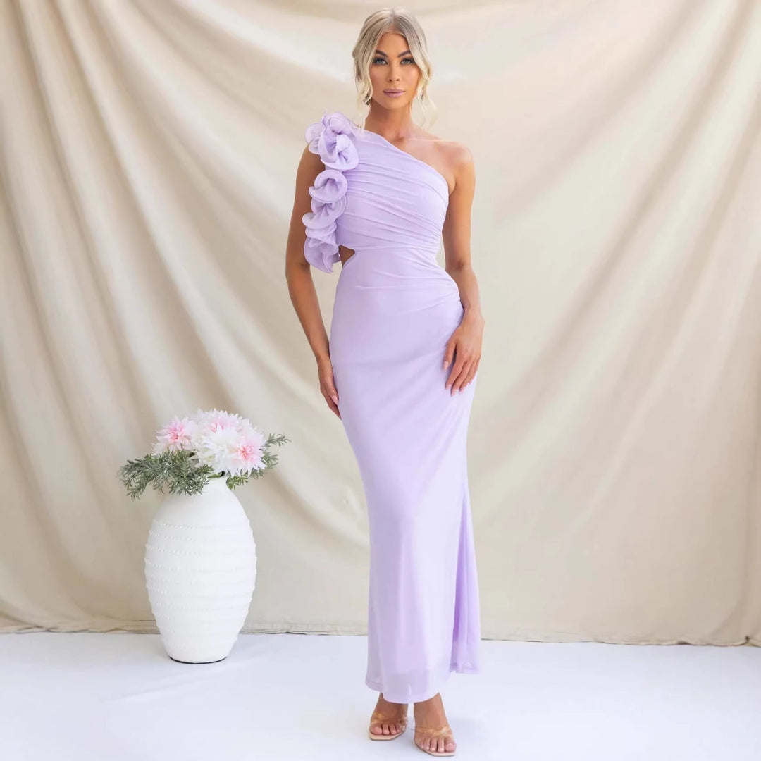 Close-up of the elegant ruffled shoulder detail on a women's maxi dress for wedding guests.
