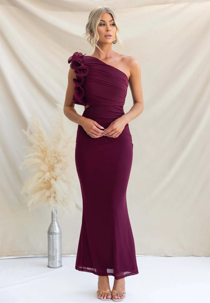 Flowy fabric texture of an elegant women's ruffled one-shoulder maxi dress, comfortable for special occasions.