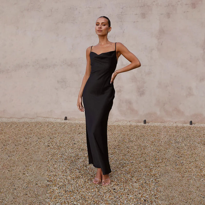 Sophisticated women's long dress with stylish open back design, ideal for formal occasions.