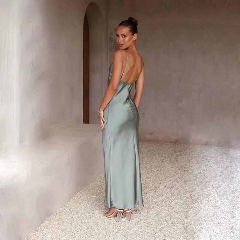 Graceful women's special occasion dress, a long flowy design with an elegant open back.