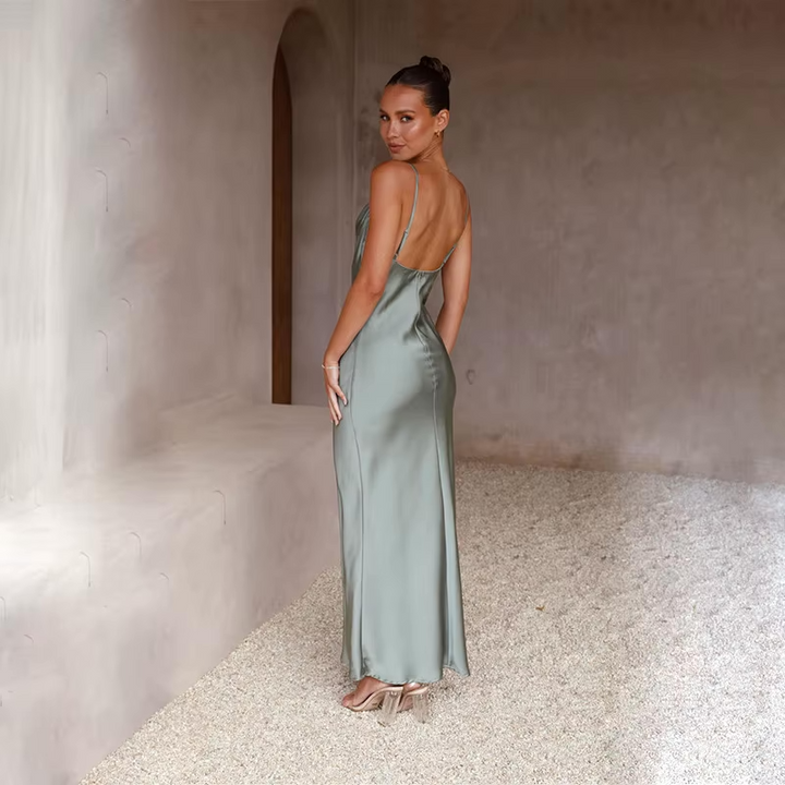 Graceful women's special occasion dress, a long flowy design with an elegant open back.