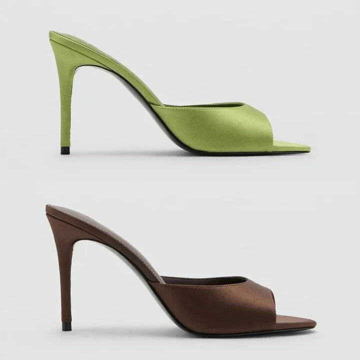 Chic women's slip-on open toe high heel mules, effortless footwear for elegant dress or evening wear.