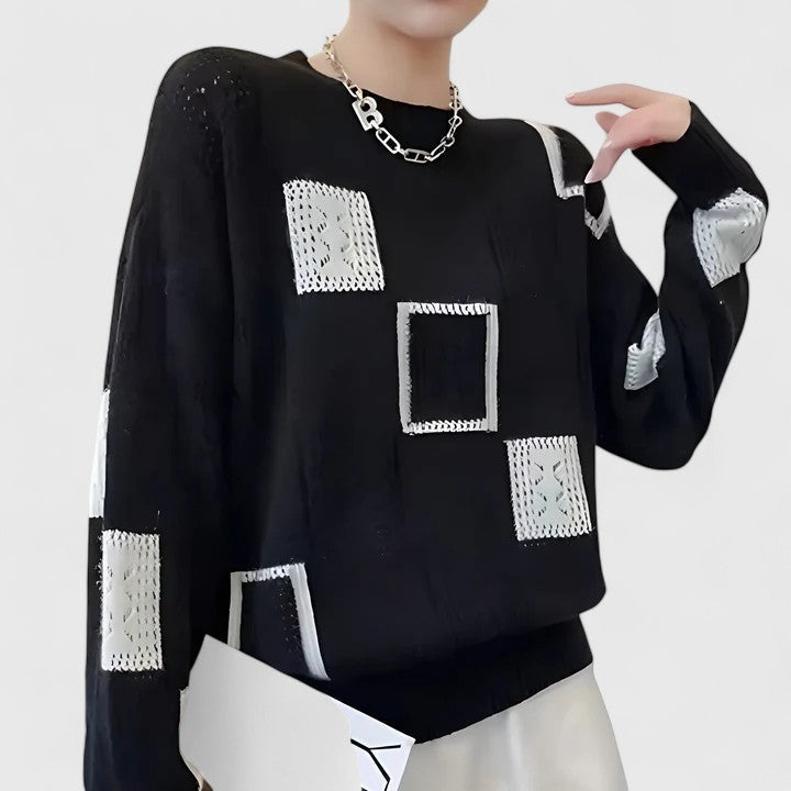Stylish women's elegant openwork knit sweater, featuring a round neck for a fashionable, comfortable look.