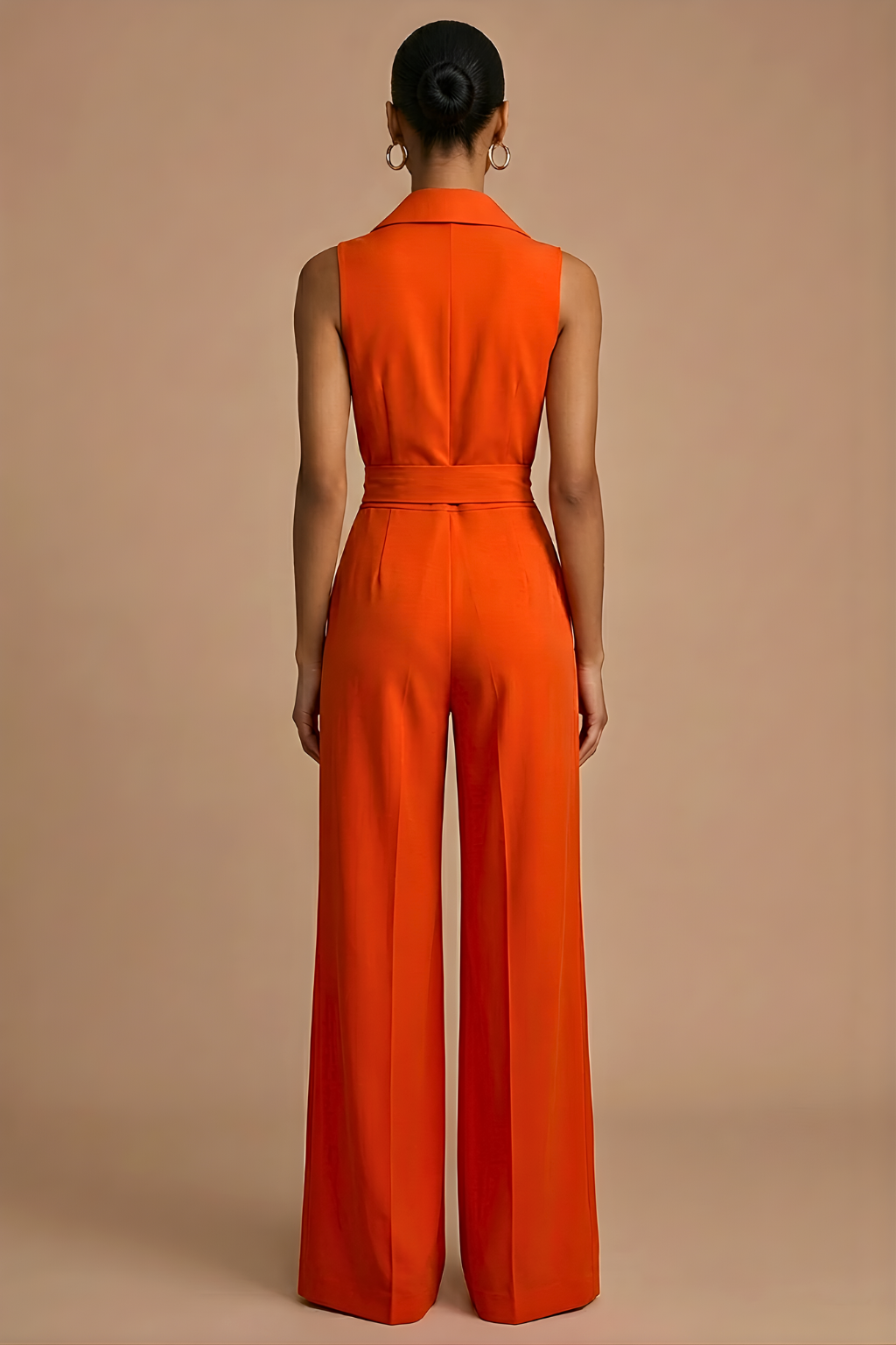 Women's elegant orange wide-leg jumpsuit with collar neck, sleeveless, and waist tie. Ideal for formal wear.