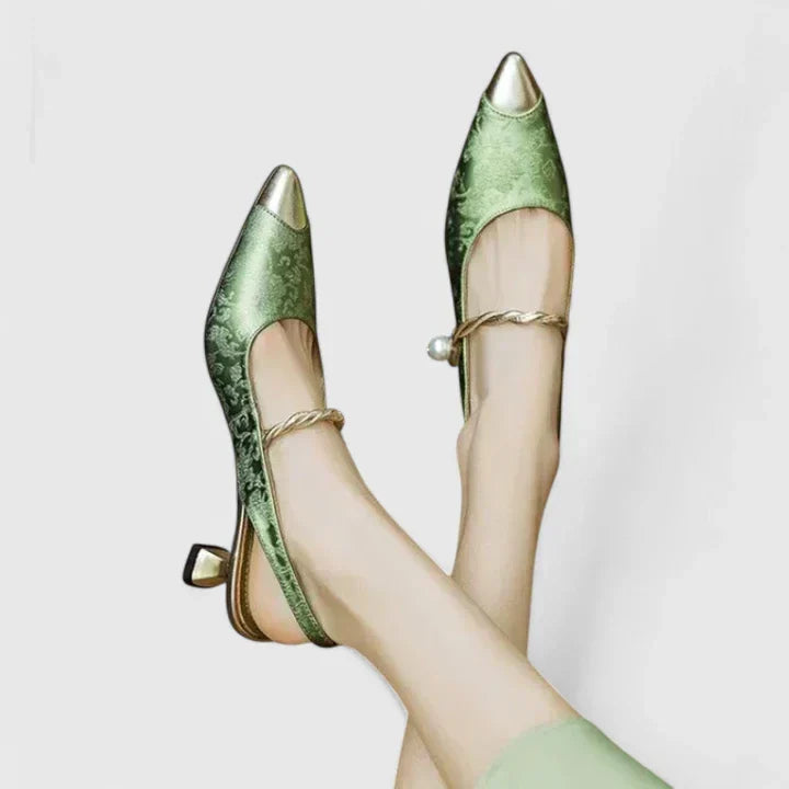 Black orthopaedic kitten heels for women, featuring a chic pearl strap. Comfortable & elegant dress shoes.