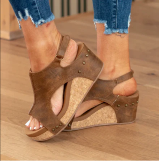 Comfortable women's orthopedic wedge sandals featuring an adjustable strap and stylish peep toe.
