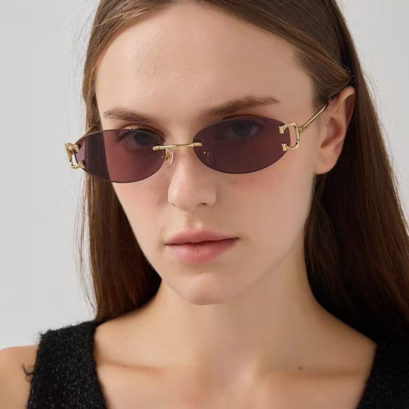 Fashionable oval sunglasses for women, offering UV protection and an elegant, designer-inspired look.