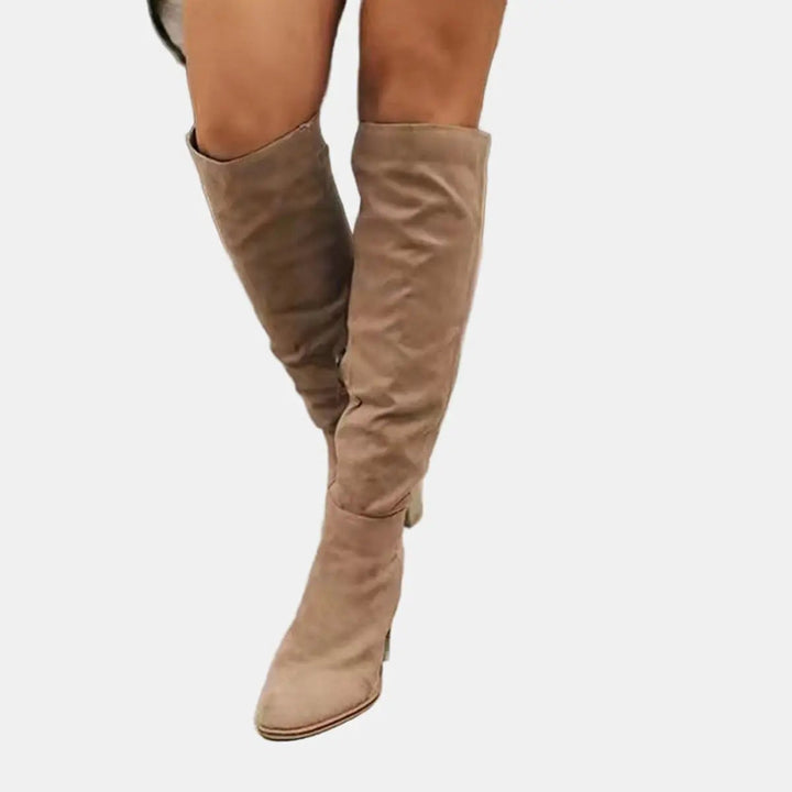 Fashionable heeled over-the-knee boots for women, featuring a comfortable and sturdy block heel.