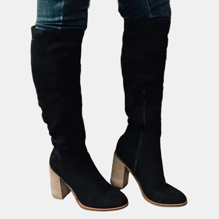 Autumn-ready women's over-the-knee boots with an elegant block heel, combining comfort & style.