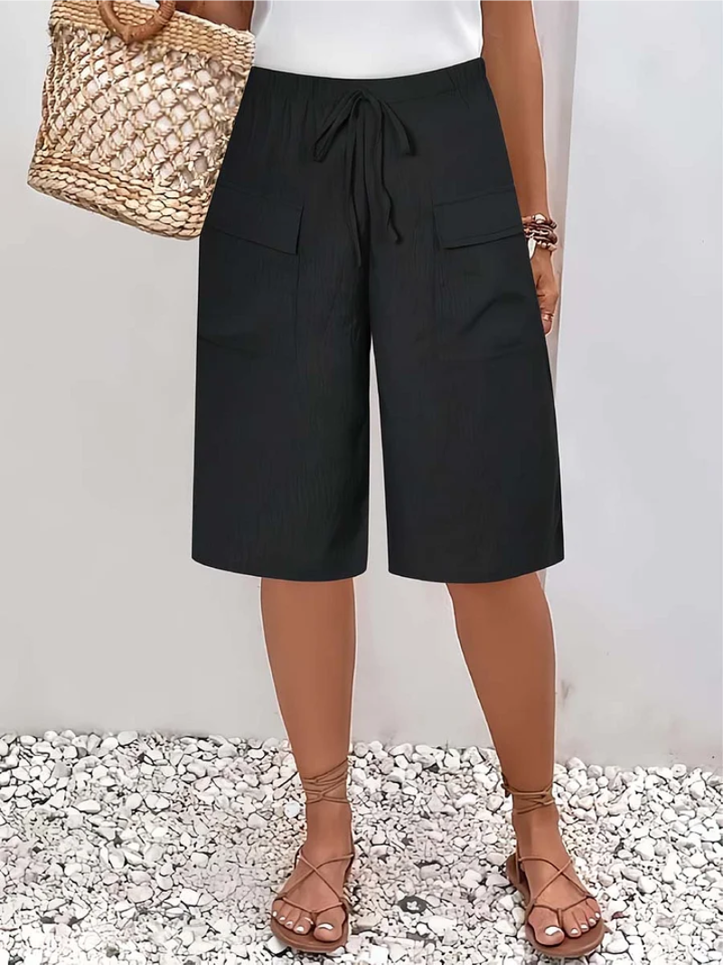 Flowy oversized lace pants for women, offering a comfortable and fashionable look. Ideal for elegant casual outfits.