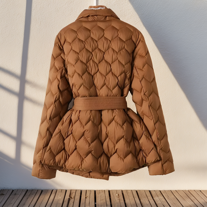 Stylish black women's padded jacket, perfect for fall and winter. Warm, elegant outerwear with a modern design.