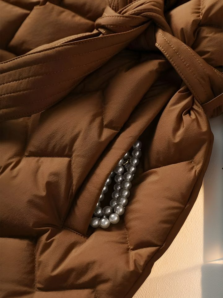 Stylish women's padded jacket, ideal for winter. Elegant caramel outerwear providing warmth and a fashionable look.