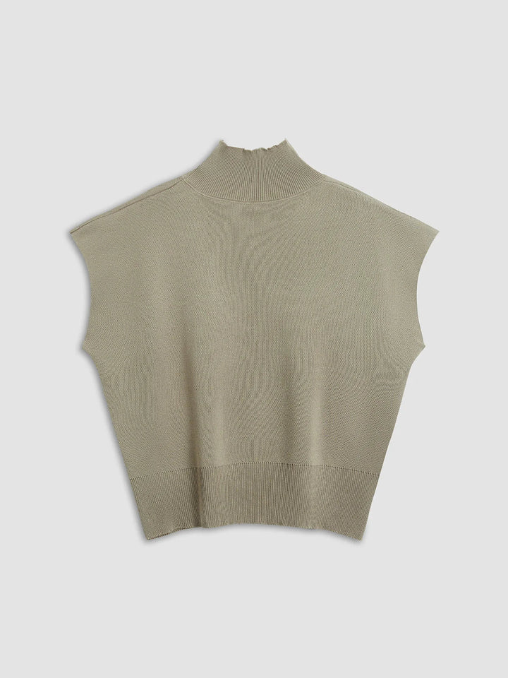 Chic everyday wear women's top: mock neck, padded shoulders, and stylish cap sleeves.