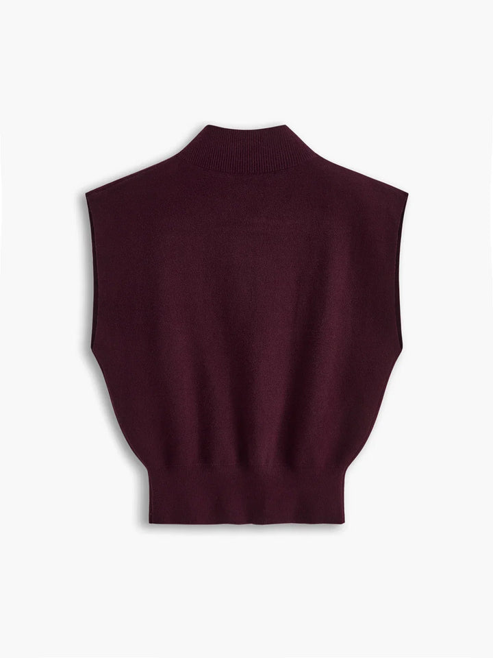 Chic women's solid color top with a mock neck, subtle padded shoulders, and flattering cap sleeves.