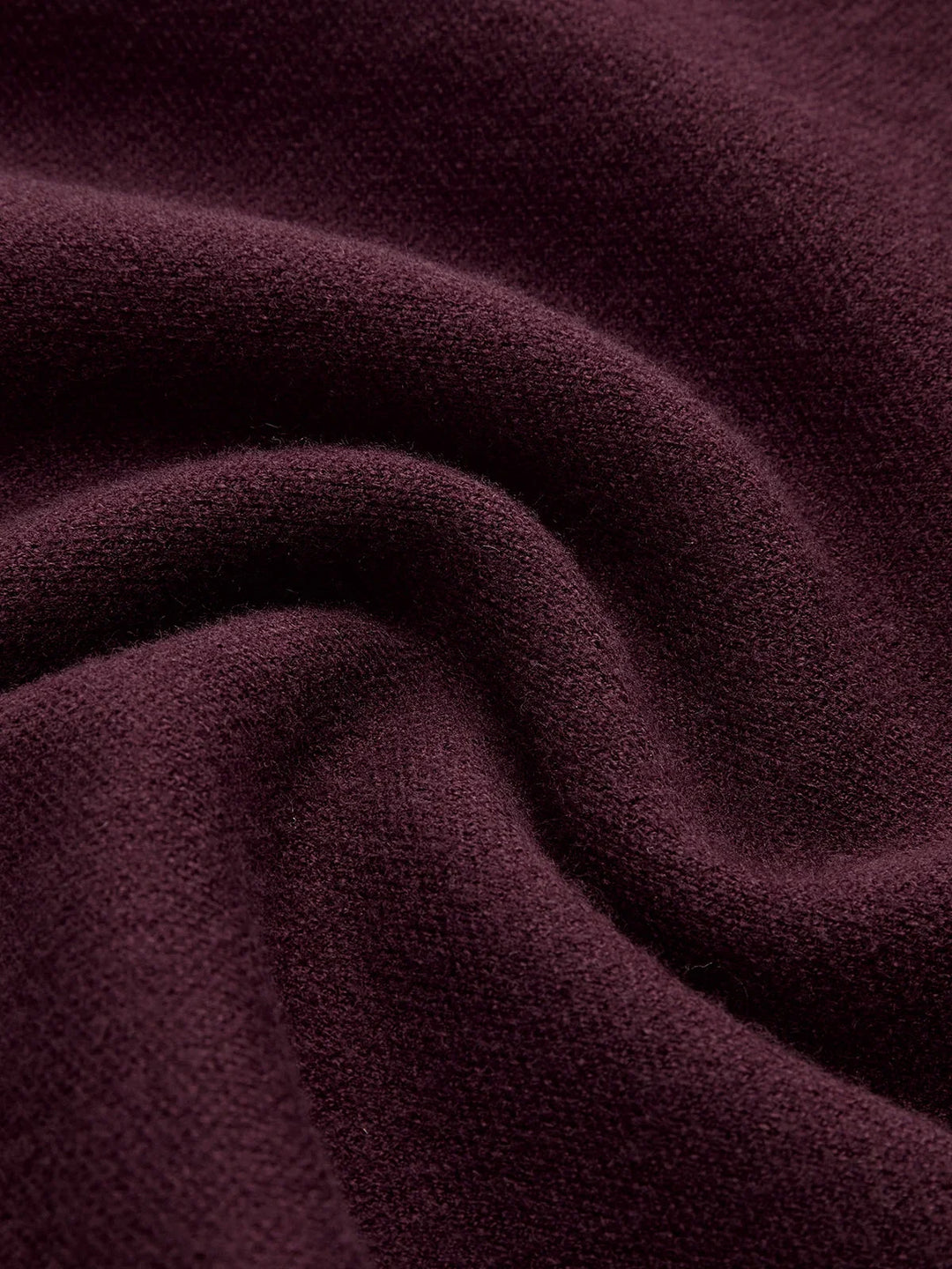 Sophisticated women's padded-shoulder sweater with a mock neck and elegant cap sleeves.
