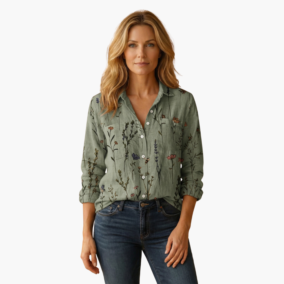 Elegant women's blouse featuring a rich paisley design and long sleeves, great for office wear.