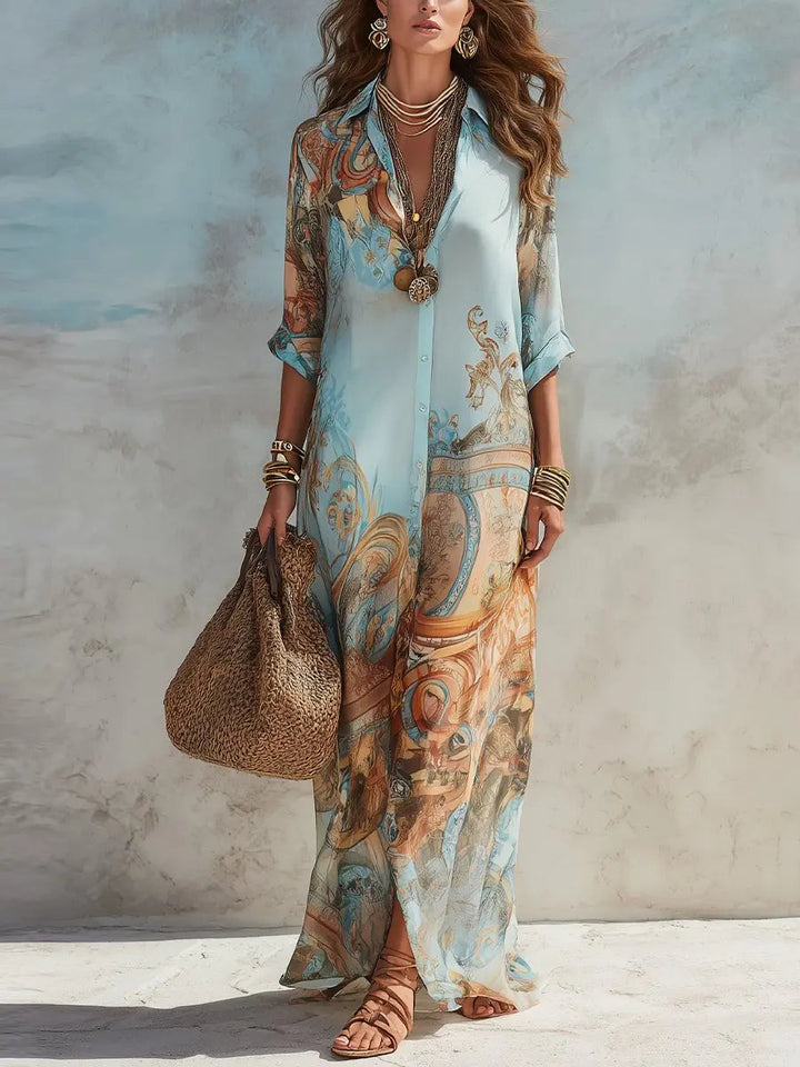 Elegant women's paisley print maxi shirt dress for summer. Flowy, button-through design, perfect for resort wear.