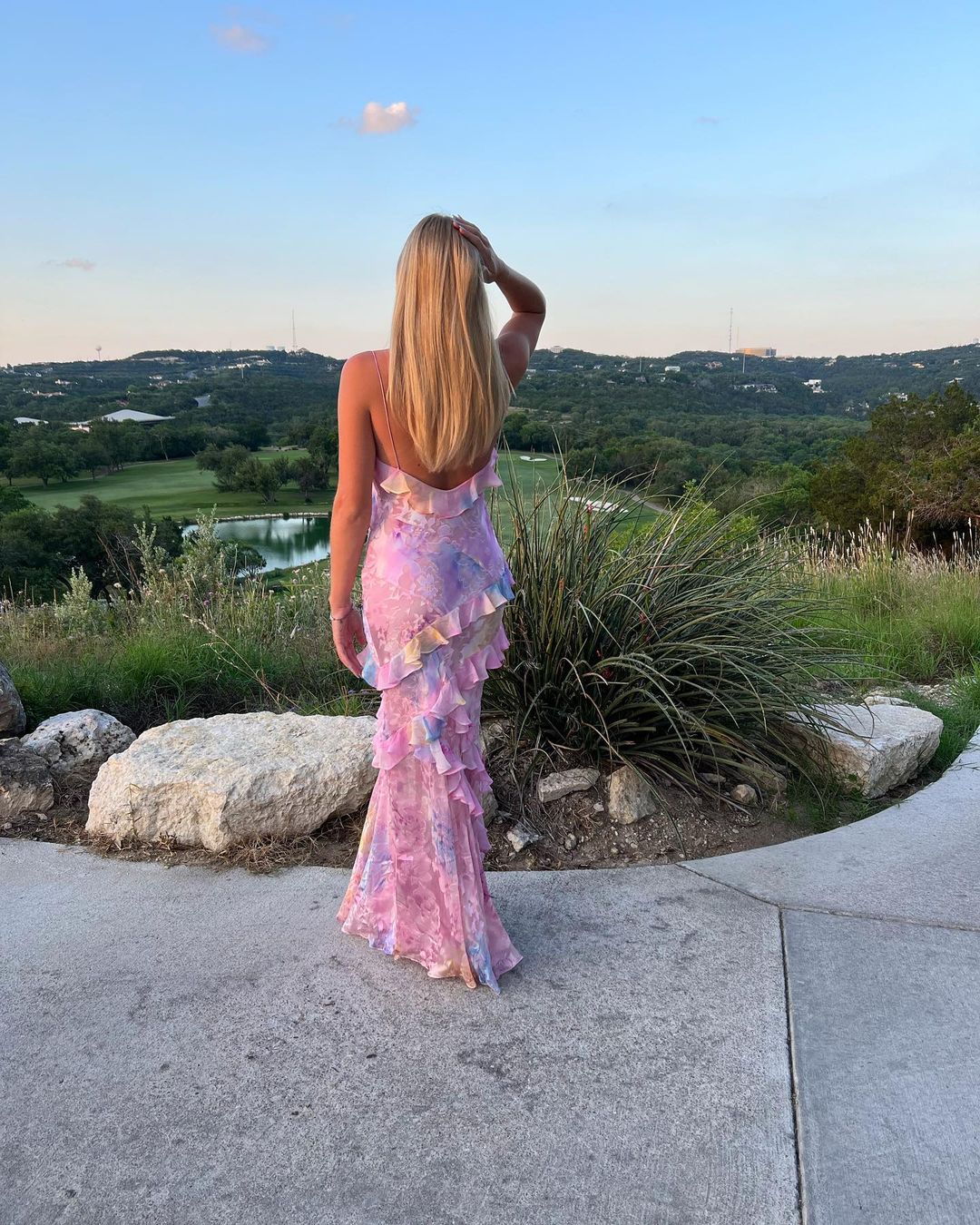 Chic women's formal maxi dress featuring delicate ruffles, a stylish choice for guests.