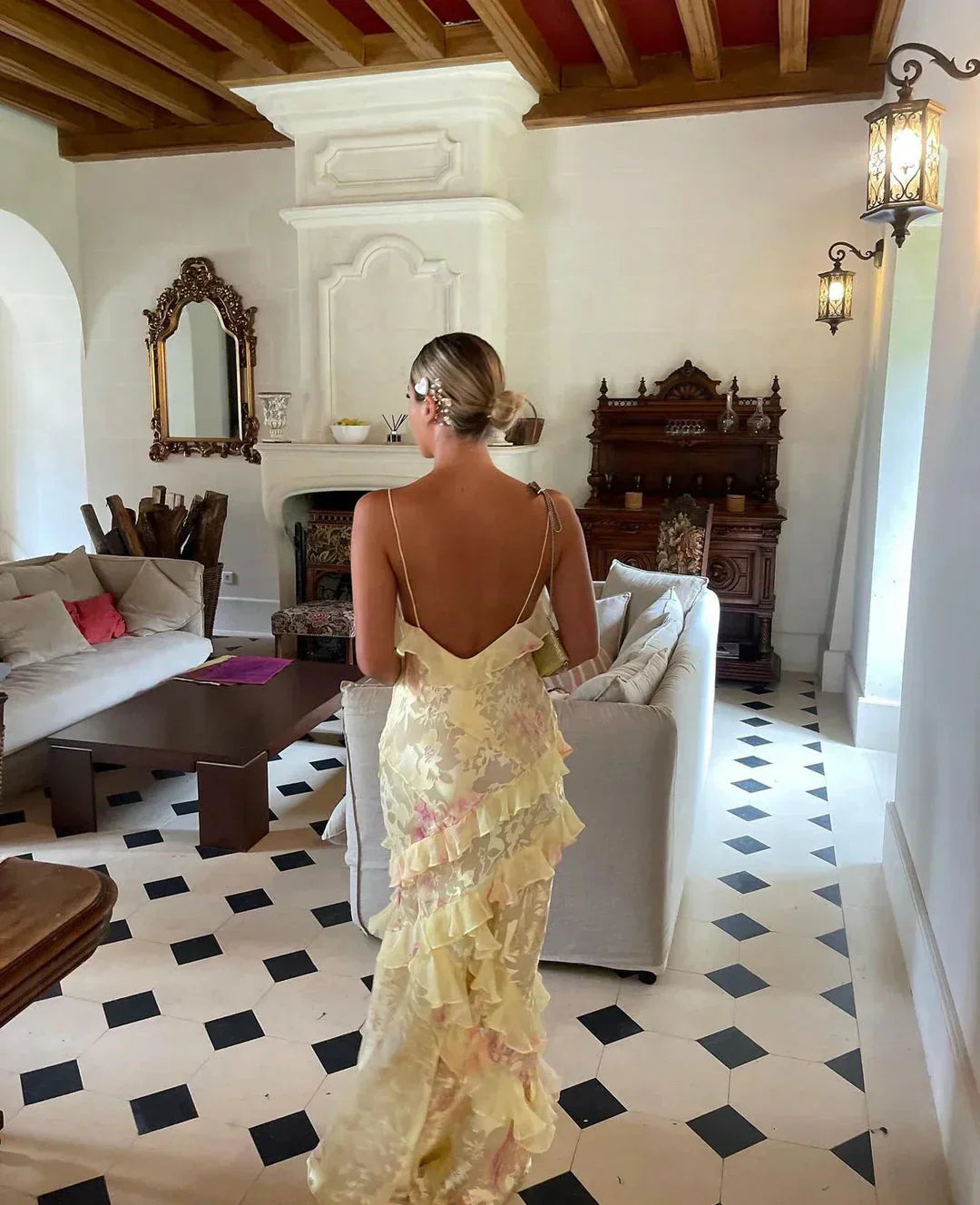 Sophisticated women's fashion: a pastel ruffle maxi dress for elegant events.