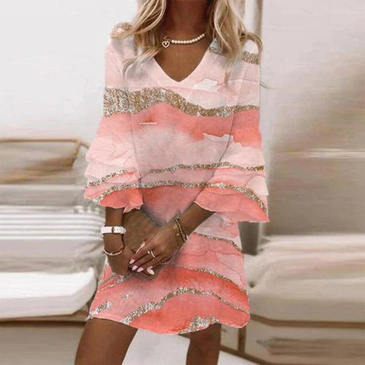 Chic women's long sleeve patterned dress, designed for a flattering fit and elegant, timeless fashion.