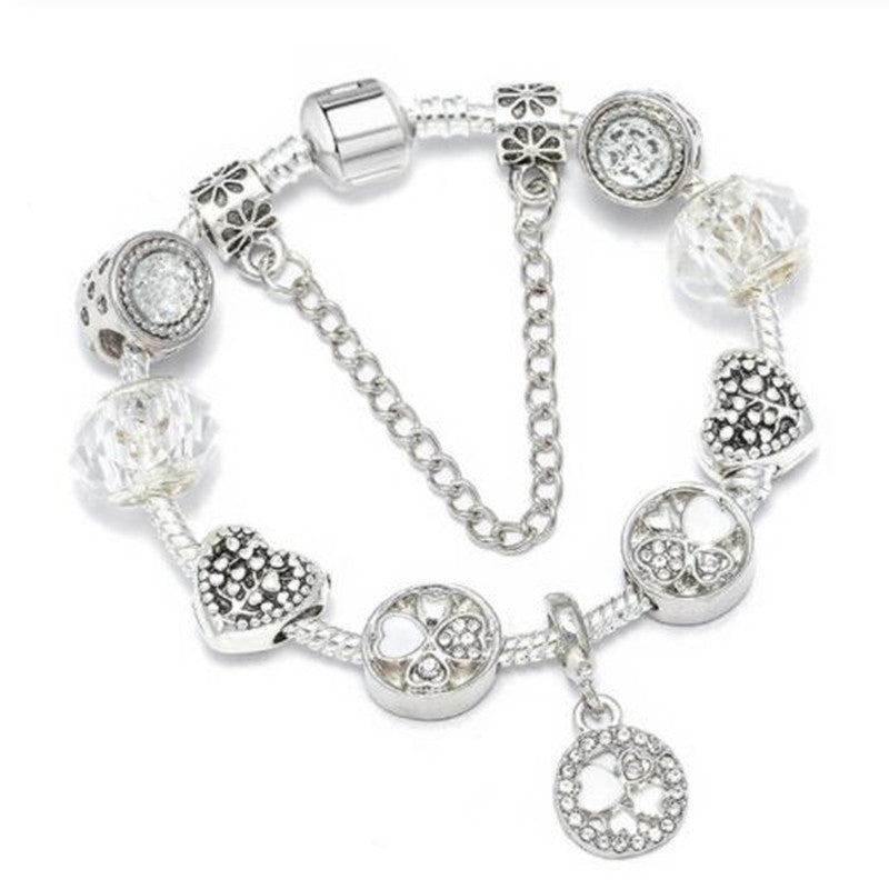 Versatile women's charm bracelet with delicate peach blossoms. Available in stylish blue, pink, or white options.