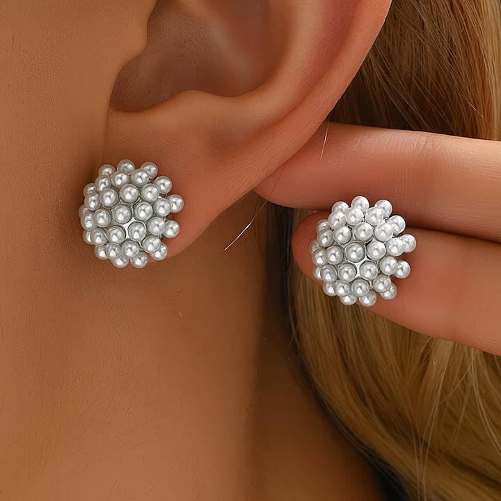 Elegant women's pearl dome stud earrings with classic design, perfect for any occasion. Hypoallergenic.