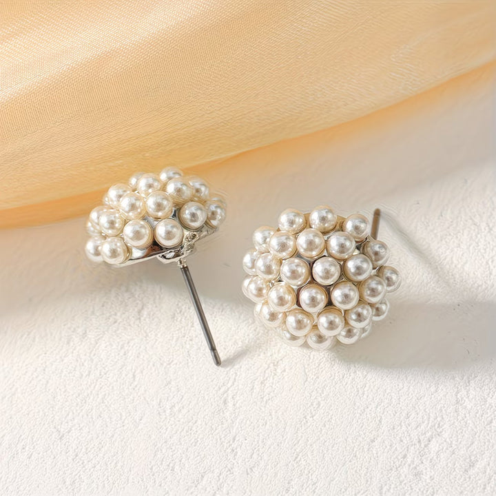 Timeless pearl dome stud earrings for women. Fashionable & elegant accessory, ideal gift. Hypoallergenic.