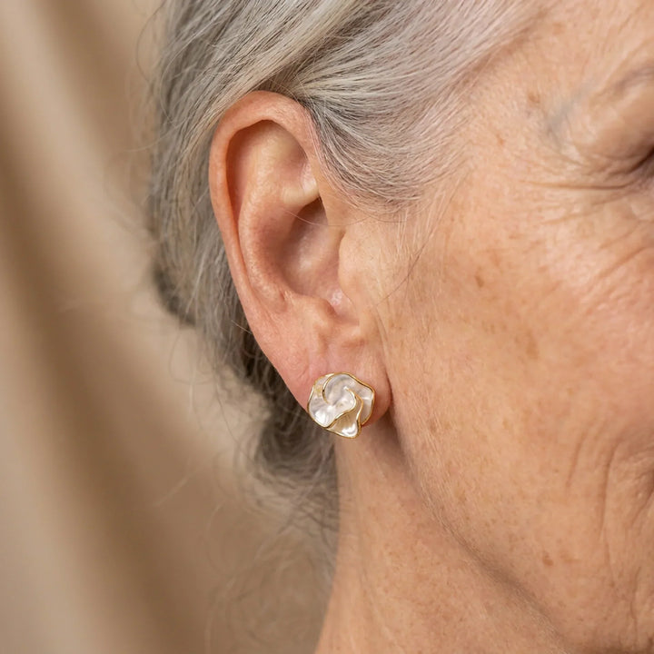 Beautiful pearl flower earrings featuring a delicate stud design, ideal women's jewelry accessory.