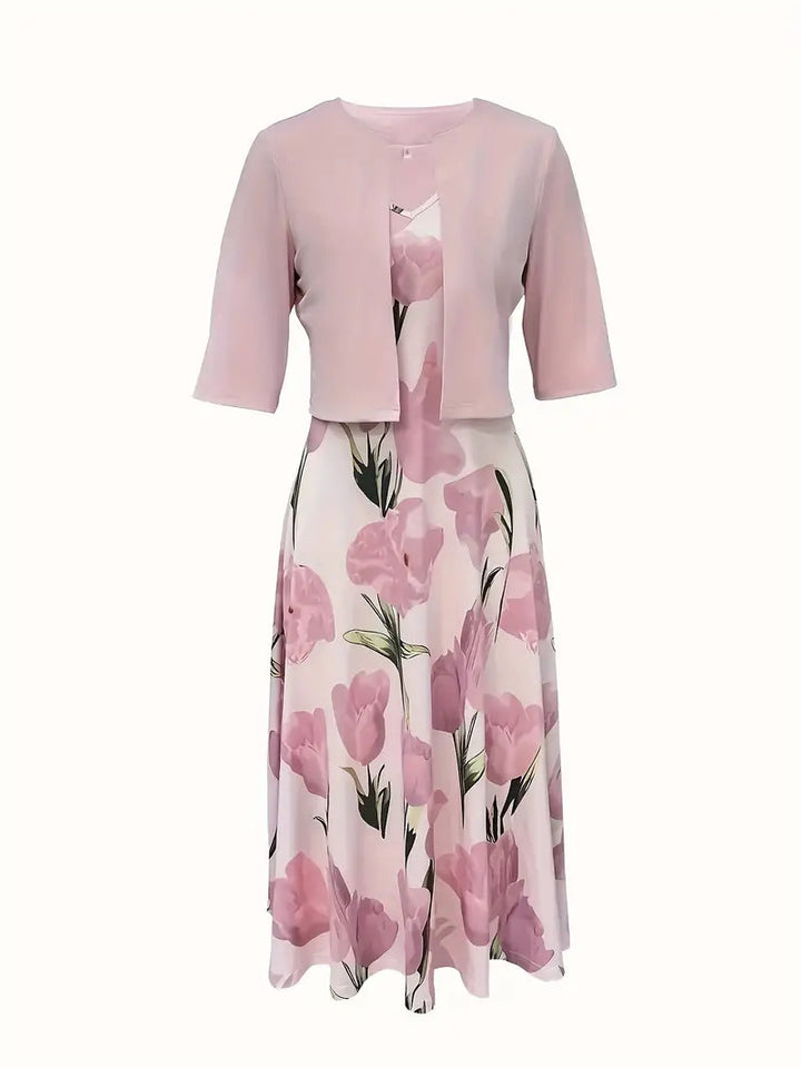 Chic women's two-piece pink floral maxi dress and jacket outfit, perfect for versatile elegant wear.