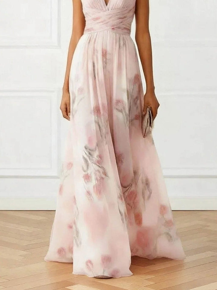 Women's elegant floral maxi dress with V-neckline & delicate pink print. Ideal formal or party wear.