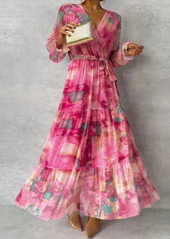 Elegant women's pink floral wrap dress, perfect for a wedding guest or spring special occasion.