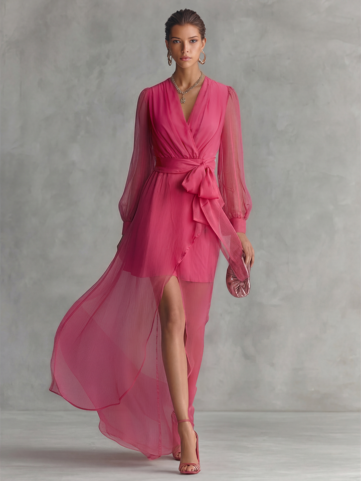 Formal pink evening gown for women, featuring a plunging V-neck, long sleeves, tie waist, and flowing A-line design.