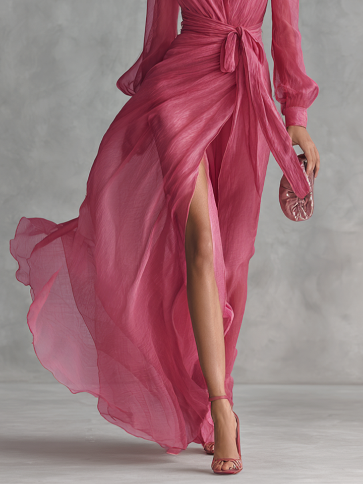 Beautiful pink formal evening dress for women, A-line cut with a plunging neck, long sleeves, and graceful floor length.
