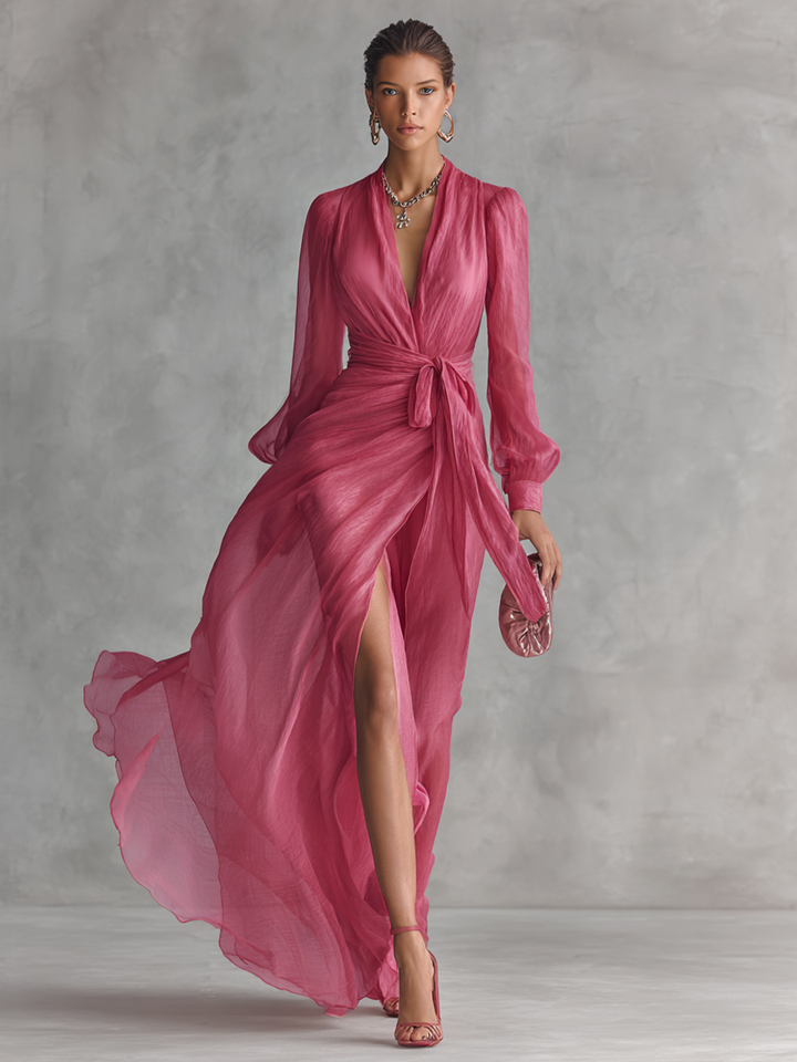 Pink formal gown for women, elegant with a plunging neck, long sleeves, tie-waist, and a sophisticated floor-length design.