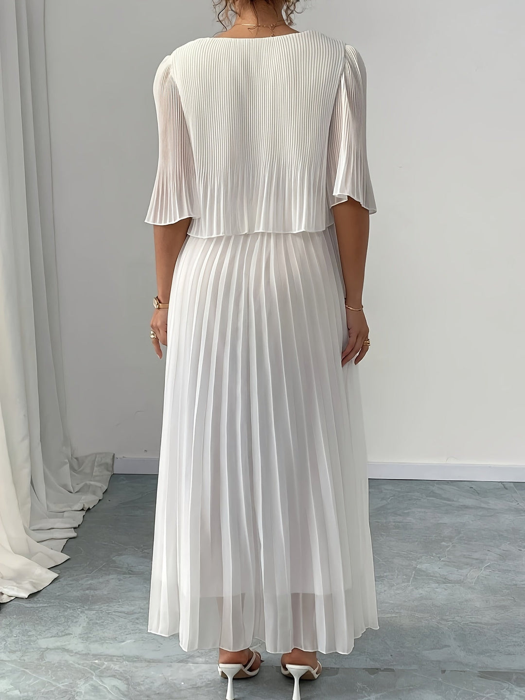 Women's A-line pleated maxi dress, perfect as a formal wedding guest dress. Elegant occasion wear.