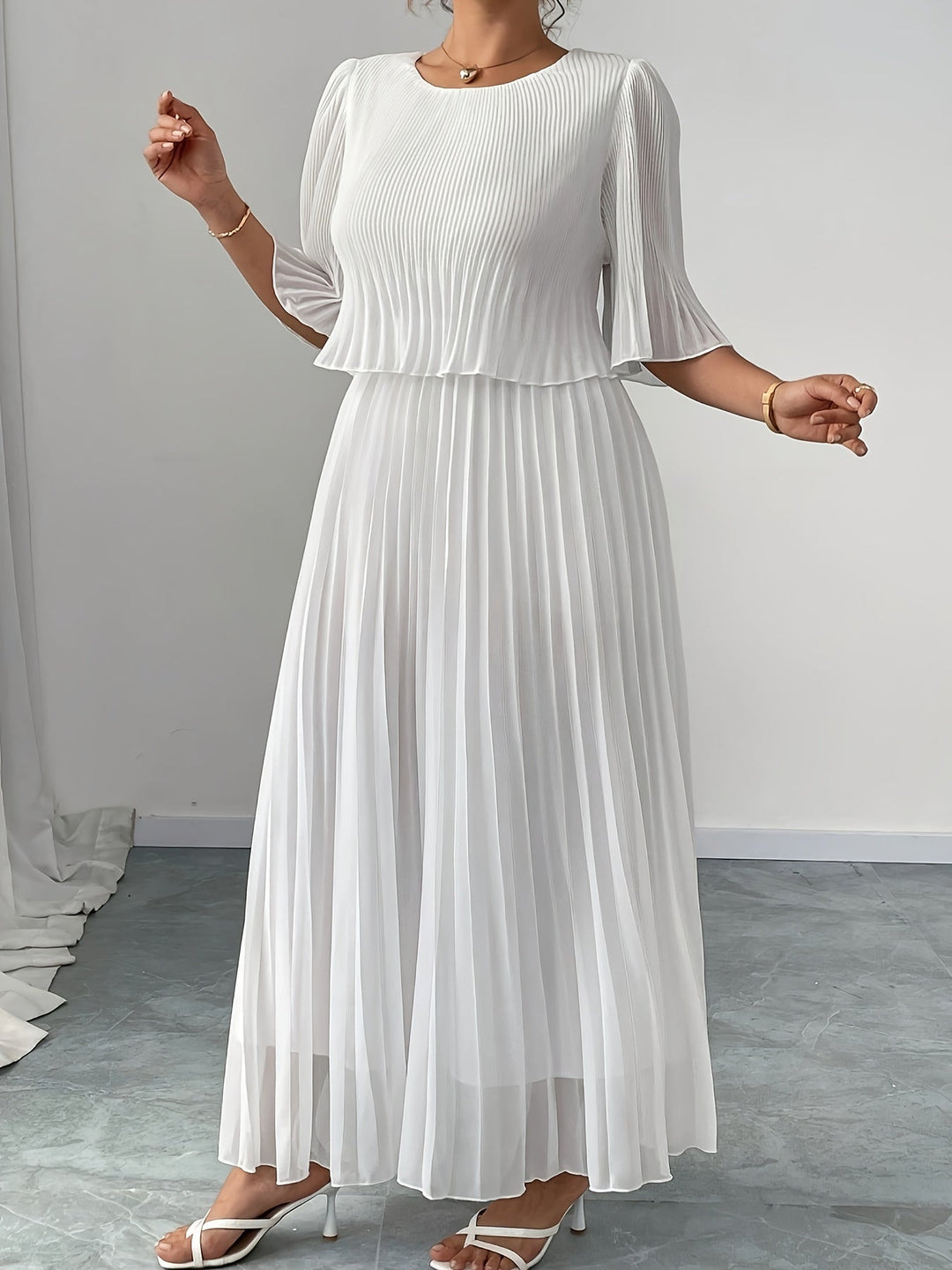 White elegant pleated maxi dress for women. A-line formal evening gown, ideal for wedding guests & events.