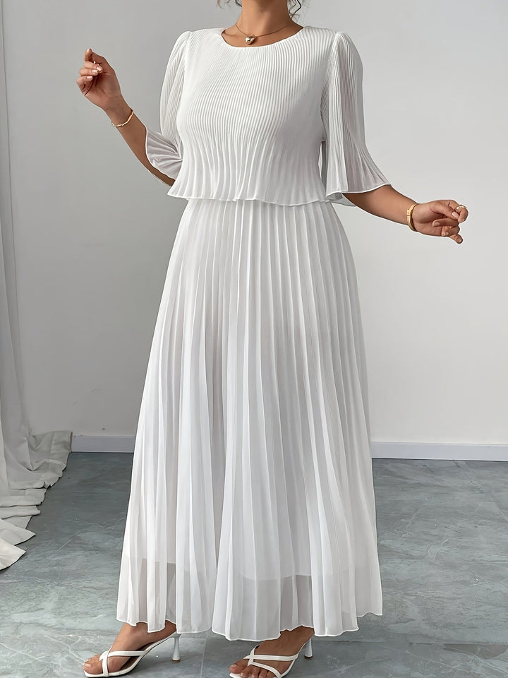 White elegant pleated maxi dress for women. A-line formal evening gown, ideal for wedding guests & events.