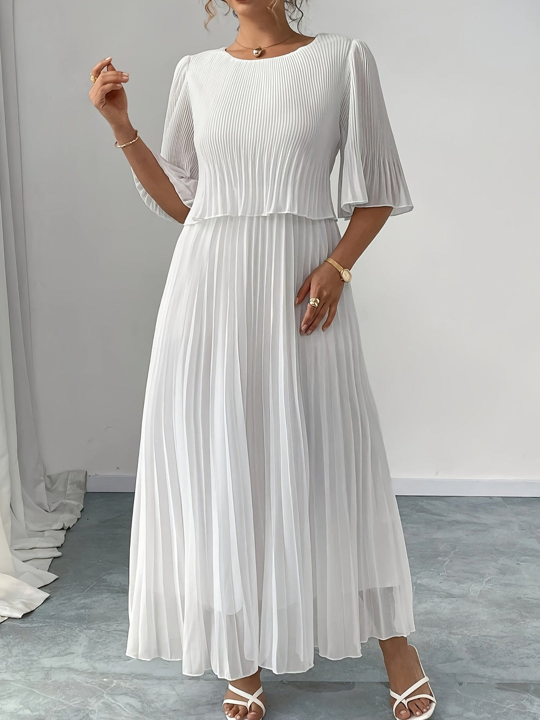 Flowing A-line pleated maxi dress, women's elegant formal wear. Perfect white wedding guest evening gown.