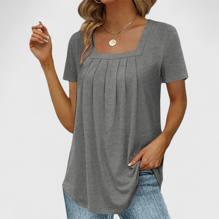 Elegant women's pleated blouse with a square neck and short sleeves, perfect for summer workwear.
