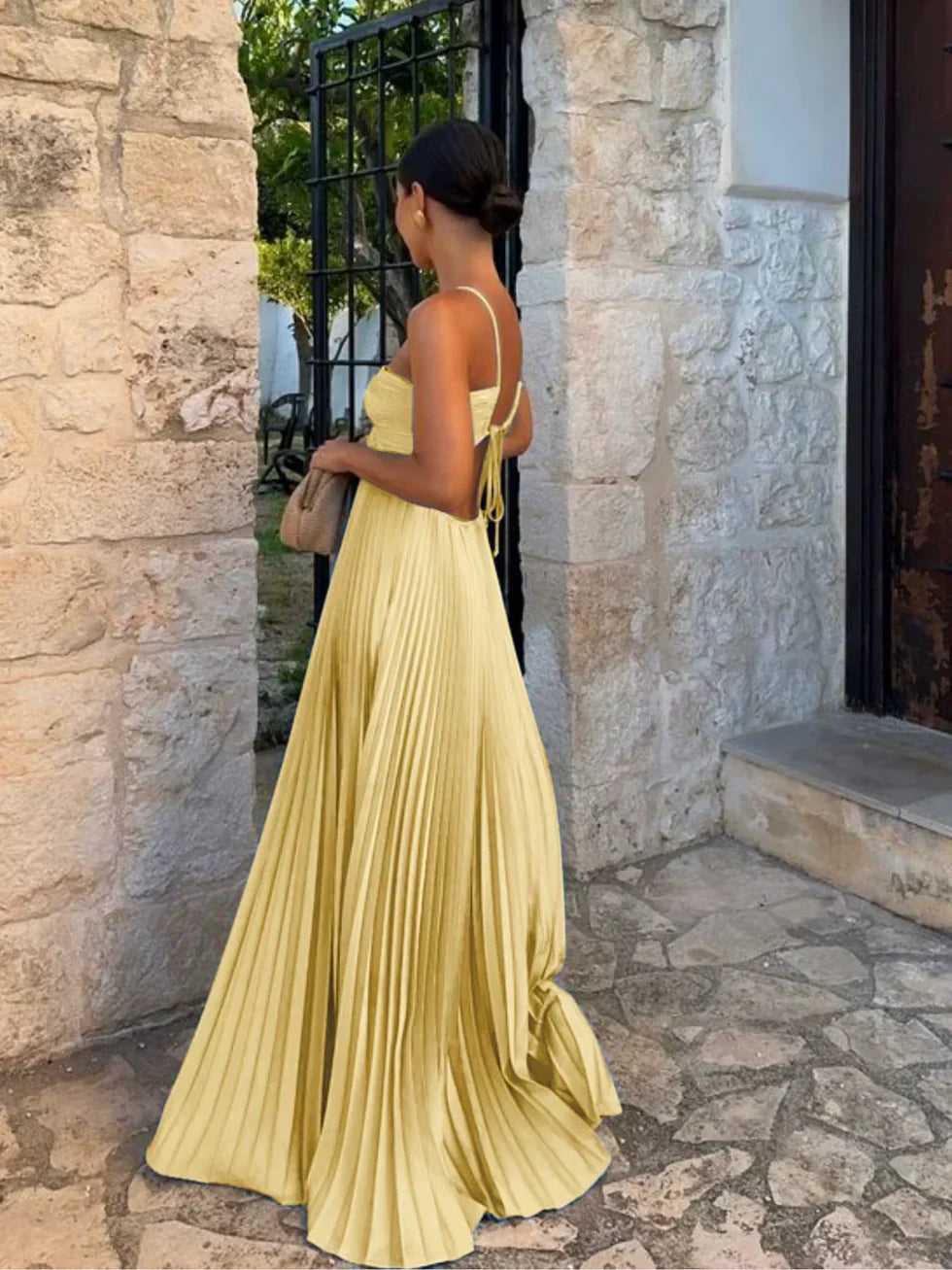 Chic women's halter neck pleated maxi dress, ideal for parties or formal events, featuring elegant side cut-outs.