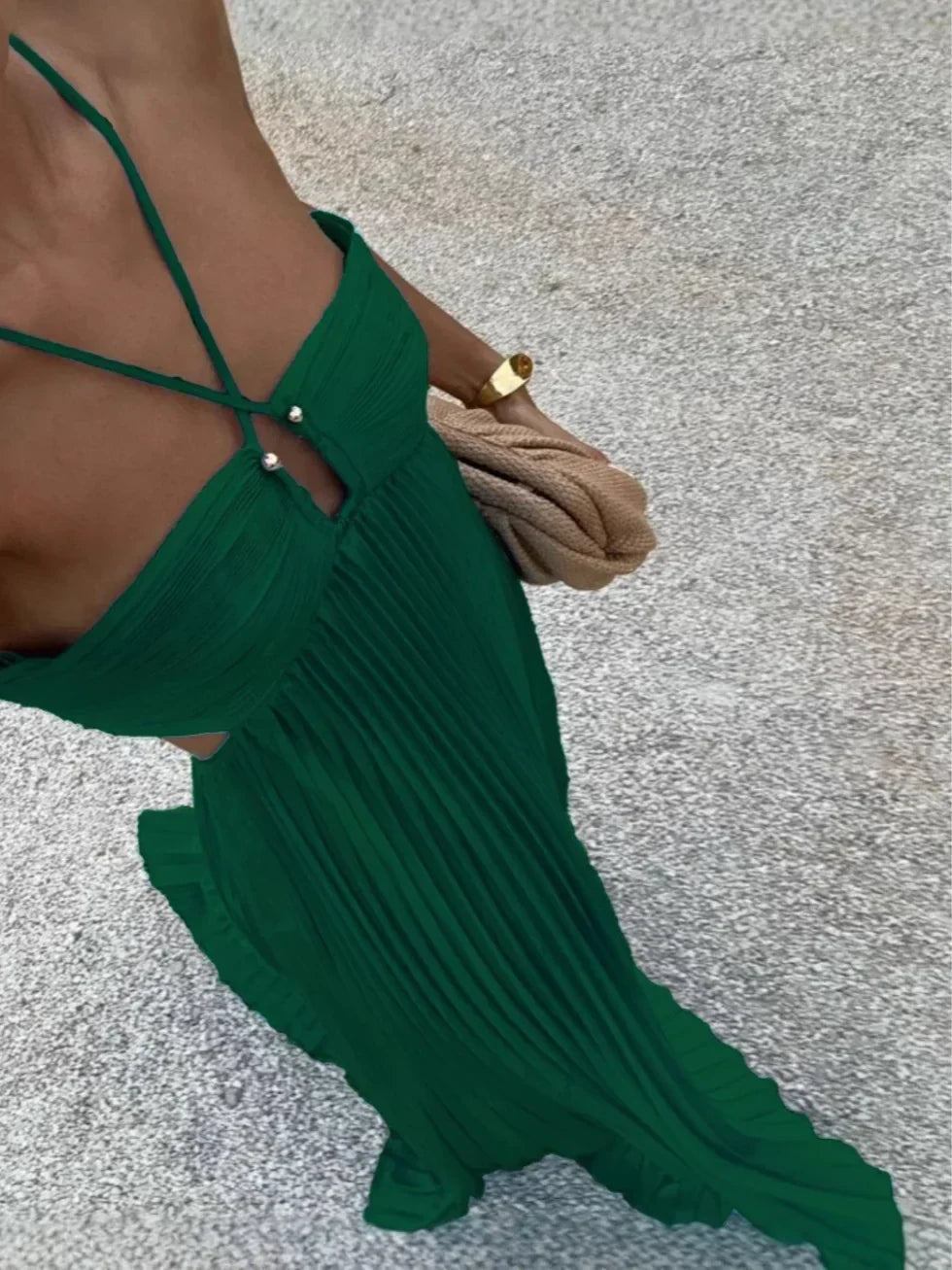 Sophisticated women's formal maxi dress with elegant pleats, a halter neck, and chic side cut-outs for special occasions.