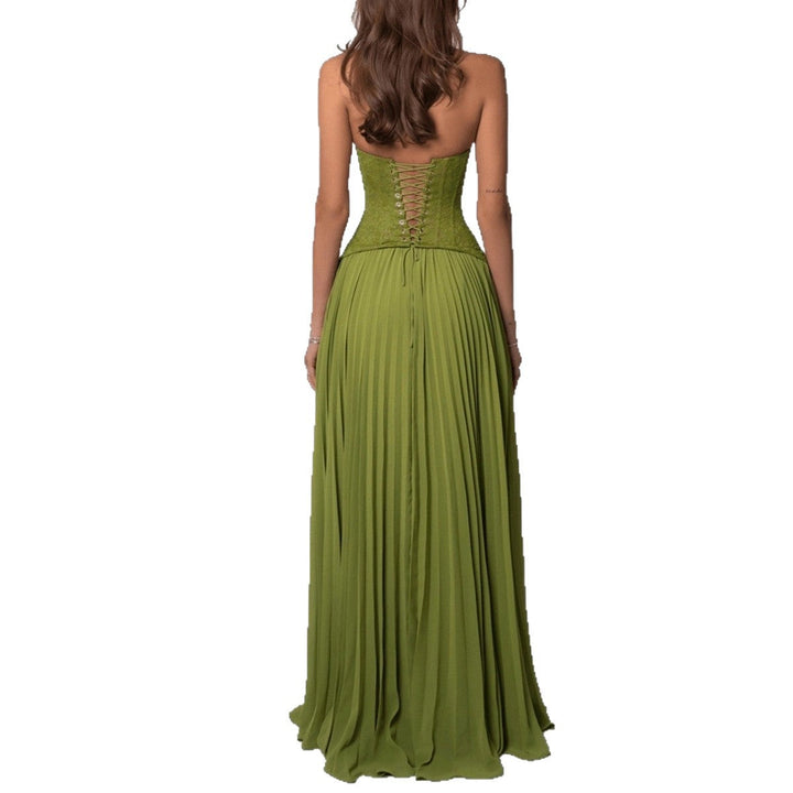 Stylish women's wedding guest dress, a full-length pleated maxi with an elegant halter neckline.
