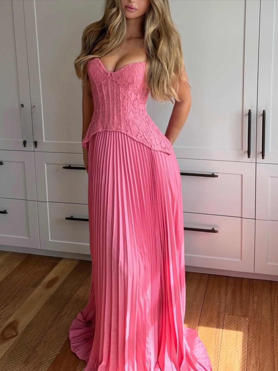 Classic pleated halterneck long dress for women, offering an elegant silhouette for any formal gathering.