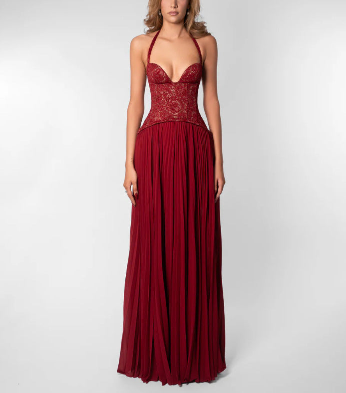 Modern women's party dress: an elegant pleated maxi with a comfortable halterneck, suitable for events.