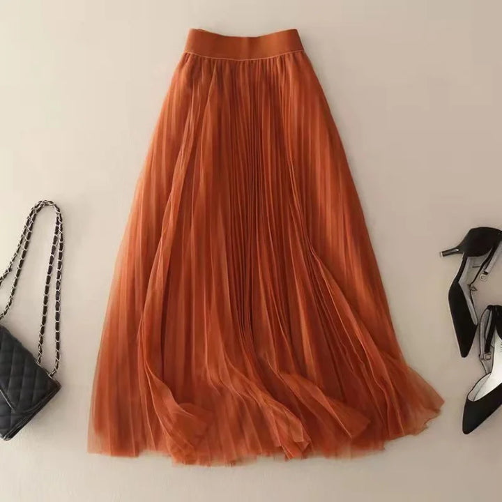 Stylish women's high-waisted A-line midi skirt with graceful pleats, versatile for fashion-forward casual or formal looks.